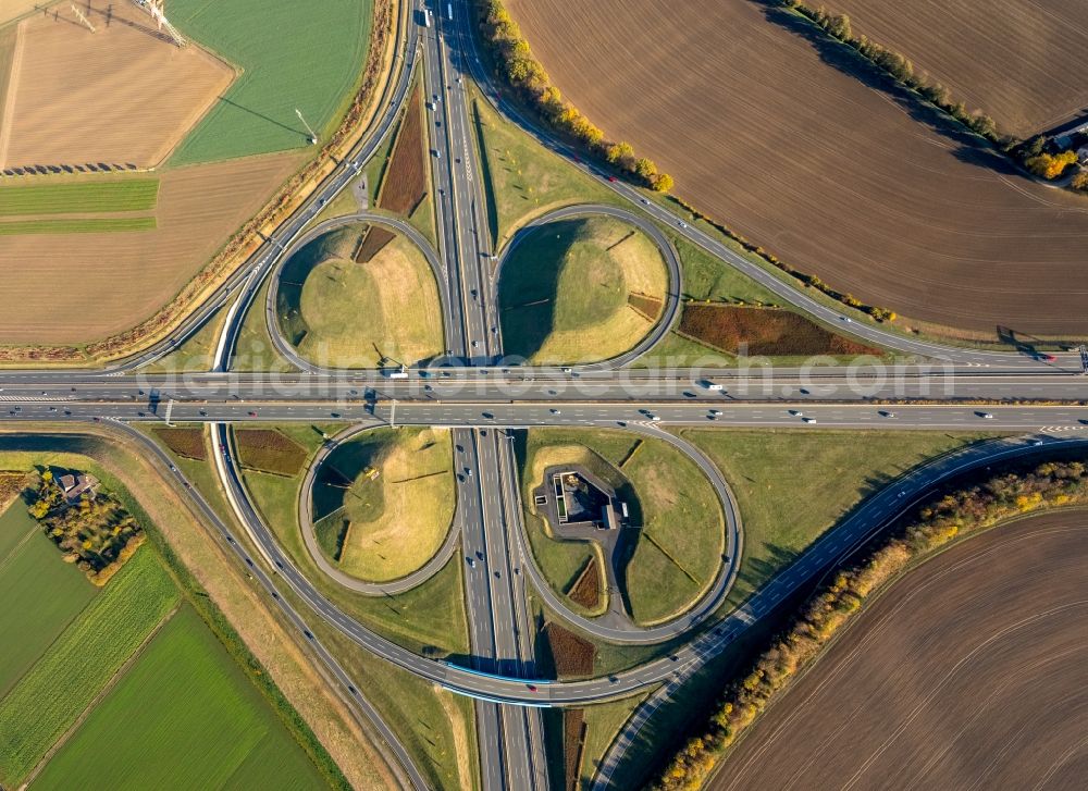 Vertical aerial photograph Kamen - Vertical aerial view from the satellite perspective of the Autumnal discolored vegetation view Traffic flow at the intersection- motorway A 1 A2 Kamener Kreuz in Kamen in the state North Rhine-Westphalia, Germany