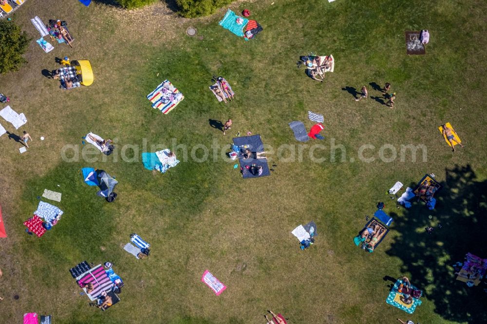 Vertical aerial photograph Dorsten - Vertical aerial view from the satellite perspective of the bathers on the lawn by the pool of the swimming pool Atlantis on Konrad-Adenauer-Platz in Dorsten in the state North Rhine-Westphalia, Germany