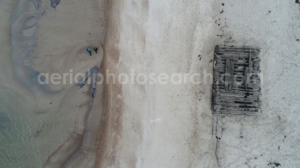 Vertical aerial photograph Glowe - Vertical aerial view from the satellite perspective of the salvage work on the ship - wreck of an old wooden merchant ship on the sandy beach in Glowe on the coast of the island of Ruegen in the state Mecklenburg-Western Pomerania, Germany