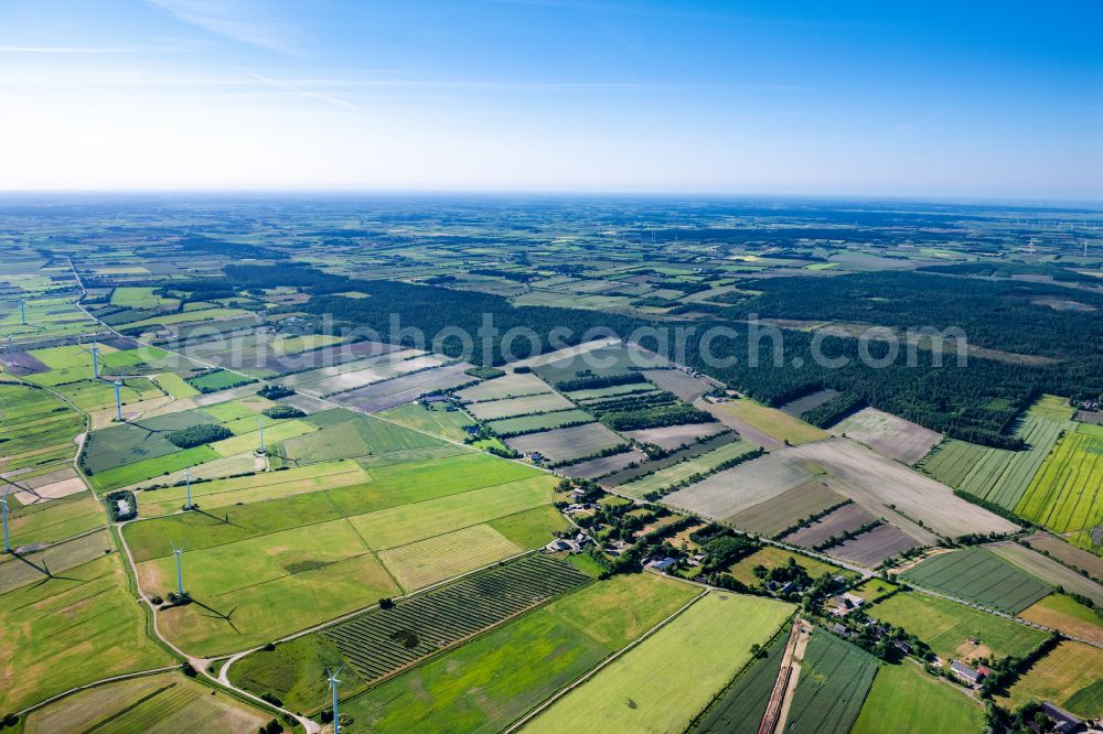 Vertical aerial photograph Ellhöft - Vertical aerial view from the satellite perspective of the agricultural land and field boundaries with the power plants surround the settlement area of the village on street Schulstrasse in Ellhoeft in the state Schleswig-Holstein, Germany