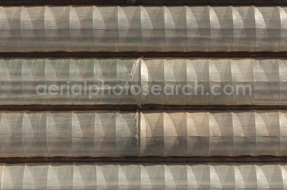 Vertical aerial photograph Pulheim - Vertical aerial view from the satellite perspective of a Field covered with plastic film in Pulheim in the state North Rhine-Westphalia, Germany