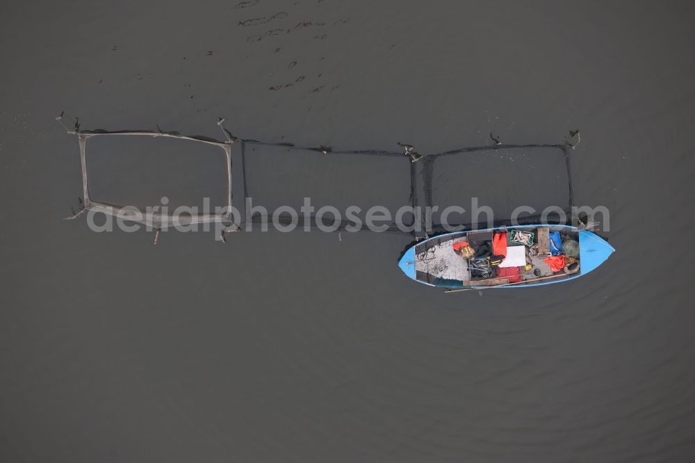 Vertical aerial photograph Warthe - Vertical aerial view from the satellite perspective of the Fishing - ship under way lake Achterwasser in Warthe in the state Mecklenburg - Western Pomerania, Germany