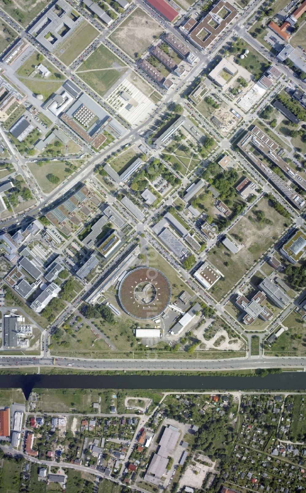 Vertical aerial photograph Berlin - Vertical aerial view from the satellite perspective of the research building and office complex Elektronen- Speicherring BESSY - Synchrotronstrahlungsquelle in the district Adlershof in Berlin, Germany