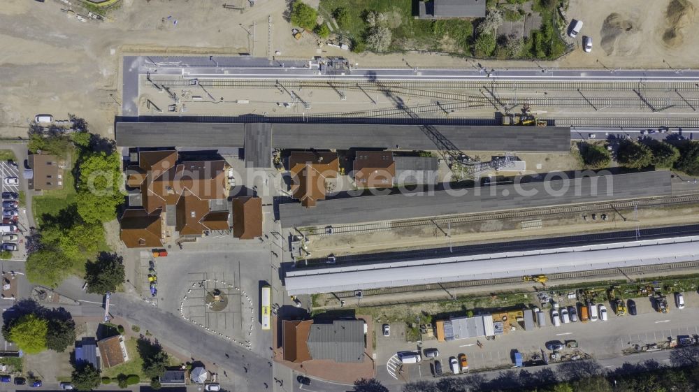 Vertical aerial photograph Rostock - Vertical aerial view from the satellite perspective of the station railway building of the Deutsche Bahn in the district Warnemuende in Rostock in the state Mecklenburg - Western Pomerania, Germany