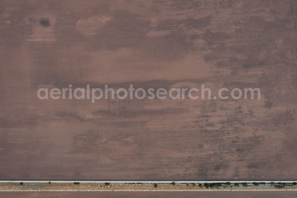 Vertical aerial photograph Llucmajor - Vertical aerial view from the satellite perspective of the Brown - white salt pans for salt extraction in the district Ses Salines in Llucmajor in Balearic Islands, Spain