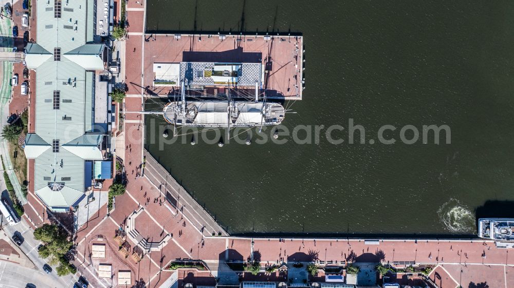 Vertical aerial photograph Baltimore - Vertical aerial view from the satellite perspective of the sailboat under way USS Constellation on street East Pratt Street in Baltimore in Maryland, United States of America