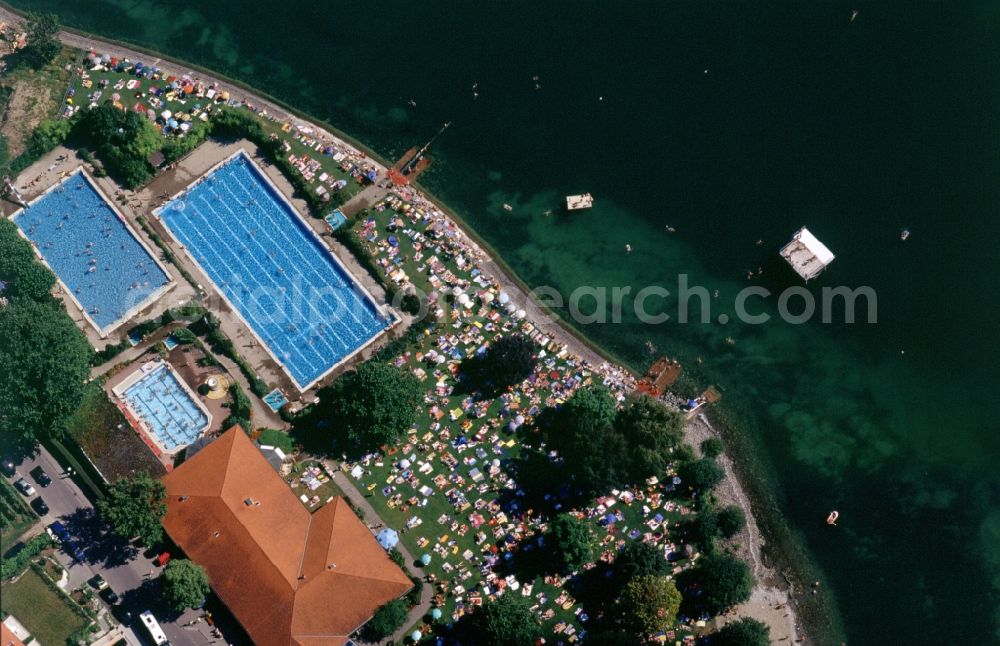 Vertical aerial photograph Meersburg - Visitors at the pool of the lido of Meersburg Therme in Baden-Württemberg