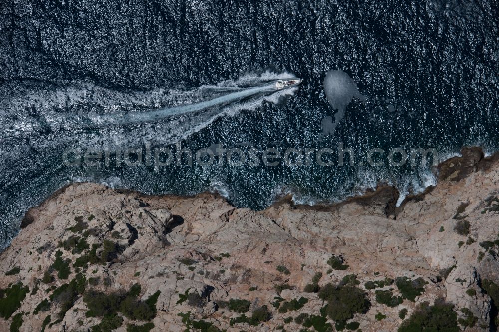 Vertical aerial photograph Andratx - Vertical aerial view from the satellite perspective of the Sailboat under way offshore in Andratx in Balearic Islands, Spain