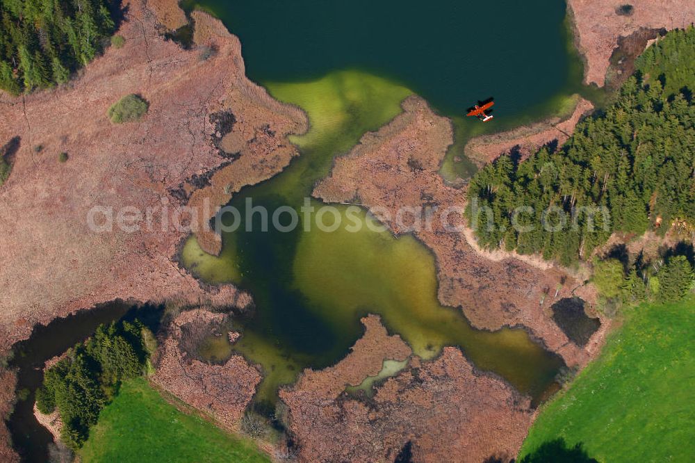 Vertical aerial photograph Schweden - Senkrechtaufnahme - Senkrechtluftbild eines roten Flugzeug / Wasserflugzeug am Ufer des Vättern / Vättersee in Schweden. Red Hydroplane at the lakeside of the lake Vaettern in Sweden.