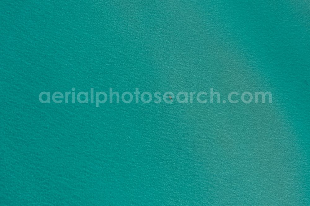 Vertical aerial photograph Llucmajo - Vertical aerial view from the satellite perspective of the Water surface at the seaside of mediteran sea in Llucmajor, beach es Trenc, man in the water, in Balearic Islands, Spain