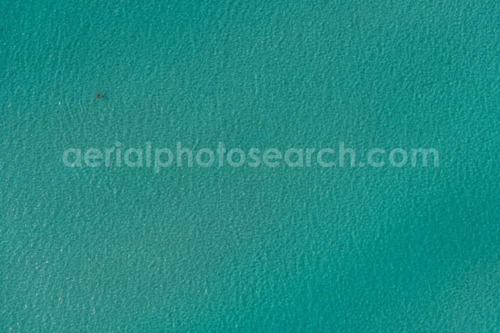 Vertical aerial photograph Llucmajo - Vertical aerial view from the satellite perspective of the Water surface at the seaside of mediteran sea in Llucmajor, beach es Trenc, man in the water, in Balearic Islands, Spain