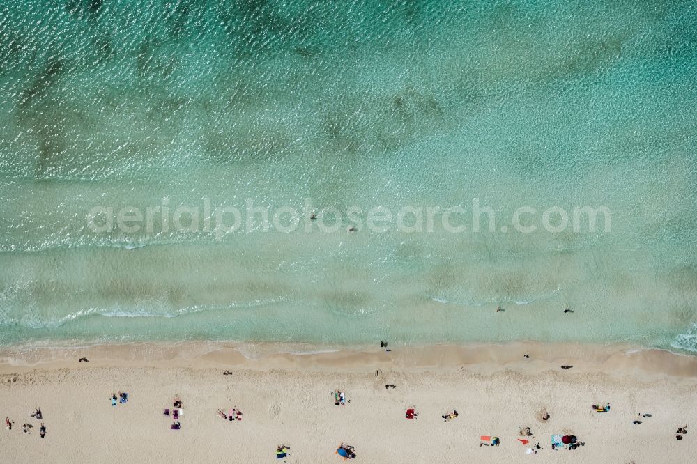 Vertical aerial photograph Llucmajor - Vertical aerial view from the satellite perspective of the Water surface at the seaside of mediteran sea in Llucmajor, people bathing in the water, people on the beach beach es Trenc, man in the water, in Balearic Islands, Spain