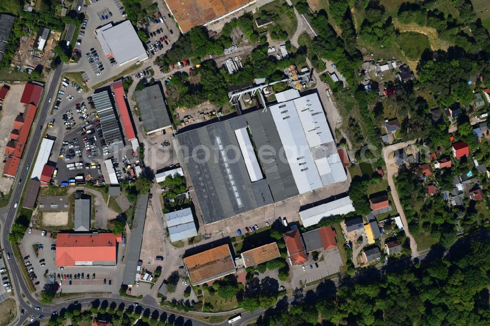 Vertical aerial photograph Biesenthal - Vertical aerial view from the satellite perspective of the building and production halls on the premises of of Moebelfolien GmbH in Biesenthal in the state Brandenburg, Germany