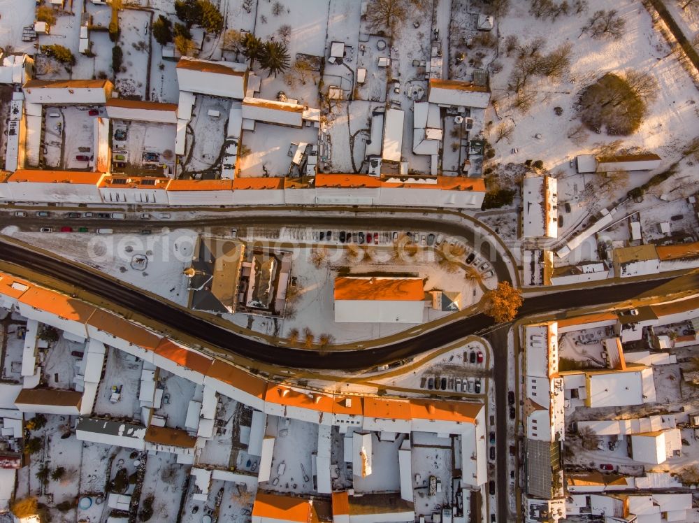 Vertical aerial photograph Liebenwalde - Wintry snowy church building in Stadtkirche on Marktplatz Old Town- center of downtown in Liebenwalde in the state Brandenburg, Germany